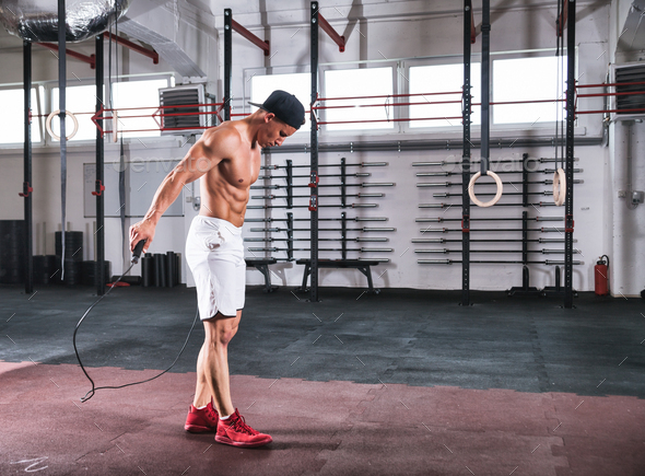 Muscular Man Skipping Exercise With Jumping Rope In Gym Stock Photo By